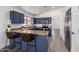Open kitchen with breakfast bar, stainless steel appliances and adjacent dining space at 11004 E Delta Ave, Mesa, AZ 85208