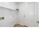 Laundry room with a shelf, utility connections and access to an exterior door at 11004 E Delta Ave, Mesa, AZ 85208