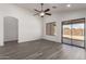 Bright living area with hardwood flooring and sliding glass door to backyard at 11004 E Delta Ave, Mesa, AZ 85208