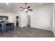 Bright living area with hardwood flooring and modern ceiling fan at 11004 E Delta Ave, Mesa, AZ 85208
