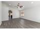 Bright living room with a modern ceiling fan, gray floors and lots of natural light at 11004 E Delta Ave, Mesa, AZ 85208