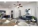 Open-concept living space connects the kitchen, dining area, and living room with lots of natural light at 11004 E Delta Ave, Mesa, AZ 85208