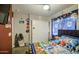 Bedroom featuring a patterned bedspread, ceiling fan, closet, and TV at 11301 W Glenrosa Ave, Phoenix, AZ 85037