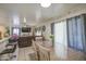 This dining area offers natural light and an open floorplan to the living room at 11301 W Glenrosa Ave, Phoenix, AZ 85037