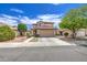 Inviting two-story home with a desert-style front yard and covered entry at 11301 W Glenrosa Ave, Phoenix, AZ 85037