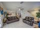 Spacious living room with tile flooring, ceiling fan, and comfortable seating at 11301 W Glenrosa Ave, Phoenix, AZ 85037