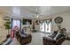Spacious living room with tile flooring, ceiling fan, and comfortable seating at 11301 W Glenrosa Ave, Phoenix, AZ 85037