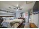The main bedroom includes a ceiling fan and ensuite bathroom at 11301 W Glenrosa Ave, Phoenix, AZ 85037