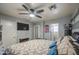 The main bedroom has a ceiling fan, tv, and ensuite at 11301 W Glenrosa Ave, Phoenix, AZ 85037