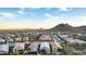 Scenic aerial shot of homes nestled near a mountain, showcasing a vibrant community at 13384 W Red Range Way, Peoria, AZ 85383