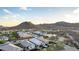 Beautiful aerial view featuring homes and mountains, with some homes having a hot tub at 13384 W Red Range Way, Peoria, AZ 85383