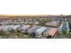 Expansive aerial view of a residential area with mountains in the background at sunset at 13384 W Red Range Way, Peoria, AZ 85383