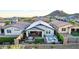 Relaxing backyard featuring an outdoor seating area, a fire pit, and a stunning in-ground spa at 13384 W Red Range Way, Peoria, AZ 85383