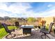 Well-maintained backyard with a stylish fire pit area and comfortable seating at 13384 W Red Range Way, Peoria, AZ 85383