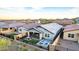 Spacious backyard featuring a covered patio, a cozy fire pit area, and an in-ground spa at 13384 W Red Range Way, Peoria, AZ 85383