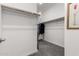 This walk-in closet with carpet features built in racks and lots of room for clothes and storage at 13384 W Red Range Way, Peoria, AZ 85383