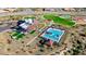Aerial view of community amenities, including pool, clubhouse, sport courts, and playgrounds at 13384 W Red Range Way, Peoria, AZ 85383