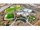 Aerial view showcasing the community amenities like pool, clubhouse, and basketball court at 13384 W Red Range Way, Peoria, AZ 85383