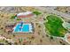 Aerial view displaying the pool, clubhouse, and sport courts for community recreation at 13384 W Red Range Way, Peoria, AZ 85383