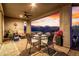 Inviting covered patio with a dining area, ceiling fan and scenic views, enhancing outdoor living at 13384 W Red Range Way, Peoria, AZ 85383