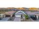 Charming home with stone accents, a two-car garage, and desert landscaping in a peaceful community at 13384 W Red Range Way, Peoria, AZ 85383