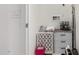 Functional laundry area with storage, appliances, and practical design at 13384 W Red Range Way, Peoria, AZ 85383