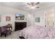 Cozy main bedroom featuring a dark wood dresser, sitting chair, and soft carpet at 13384 W Red Range Way, Peoria, AZ 85383