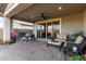 Spacious covered patio with ample seating, perfect for outdoor entertaining at 13384 W Red Range Way, Peoria, AZ 85383