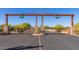 Grand entrance gate of Granite Mountain Ranch with decorative wreaths at 14118 E Rancho Del Oro Ct, Scottsdale, AZ 85262