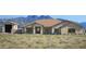 Charming single-story home boasting a tile roof, stone accents, and scenic mountain views at 14118 E Rancho Del Oro Ct, Scottsdale, AZ 85262