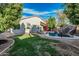 Enjoy the backyard's pool with rock slide, basketball hoop, and lawn area, perfect for relaxation and outdoor fun at 1508 S Danyell Pl, Chandler, AZ 85286
