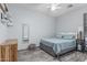 This bedroom features a bed, a chest of drawers, and a mirror at 1508 S Danyell Pl, Chandler, AZ 85286