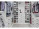 Organized walk-in closet with custom shelving, drawers, and ample storage space at 1508 S Danyell Pl, Chandler, AZ 85286
