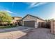 Single-story home featuring low maintenance desert landscaping, a two-car garage, and fenced side yard at 1508 S Danyell Pl, Chandler, AZ 85286