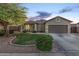 Charming single-story home with a well-manicured lawn, desert landscaping, and a two-car garage at 1508 S Danyell Pl, Chandler, AZ 85286