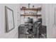 This home office features 2 monitors, shelves, and a NEST sign at 1508 S Danyell Pl, Chandler, AZ 85286