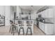 Well-appointed kitchen with white cabinets, stainless steel appliances, granite countertops, and bar seating at 1508 S Danyell Pl, Chandler, AZ 85286