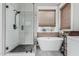 Charming main bath with soaking tub, shower, and wood accent wall at 1508 S Danyell Pl, Chandler, AZ 85286