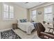 Cozy bedroom with shuttered windows, comfortable bed, and stylish accents at 1588 E Sweet Citrus Dr, Queen Creek, AZ 85140