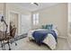 Well-lit bedroom with a desk, white shutters, and a comfortable bed at 1588 E Sweet Citrus Dr, Queen Creek, AZ 85140
