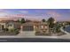 Charming single-story home with a well-maintained lawn, desert landscaping, and a two-car garage at 1588 E Sweet Citrus Dr, Queen Creek, AZ 85140
