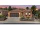 Charming single-story home with a well-manicured front yard, desert landscaping, a two-car garage, and inviting curb appeal at 1588 E Sweet Citrus Dr, Queen Creek, AZ 85140