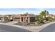 Single-story home with two-car garage, desert landscaping, and manicured lawn at 1588 E Sweet Citrus Dr, Queen Creek, AZ 85140