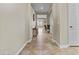 Hallway with tiled floors, neutral paint, and decor at 1588 E Sweet Citrus Dr, Queen Creek, AZ 85140