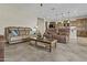 Spacious living room with comfortable seating, modern decor, and an open flow to the kitchen at 1588 E Sweet Citrus Dr, Queen Creek, AZ 85140