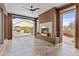 Relaxing covered patio with a cozy fireplace and views of the backyard at 1588 E Sweet Citrus Dr, Queen Creek, AZ 85140