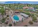 Aerial view of the community pool and clubhouse area with surrounding mountain views at 17289 E Kirk Ln, Fountain Hills, AZ 85268
