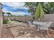 Private backyard patio area features a dining set, lounge chairs, and desert landscaping at 17289 E Kirk Ln, Fountain Hills, AZ 85268