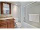 Clean bathroom featuring stylish vanity, ample lighting, and shower-tub combo, and white walls at 17289 E Kirk Ln, Fountain Hills, AZ 85268