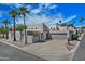 Contemporary home with a desert landscape featuring palm trees and an attached two-car garage at 17289 E Kirk Ln, Fountain Hills, AZ 85268